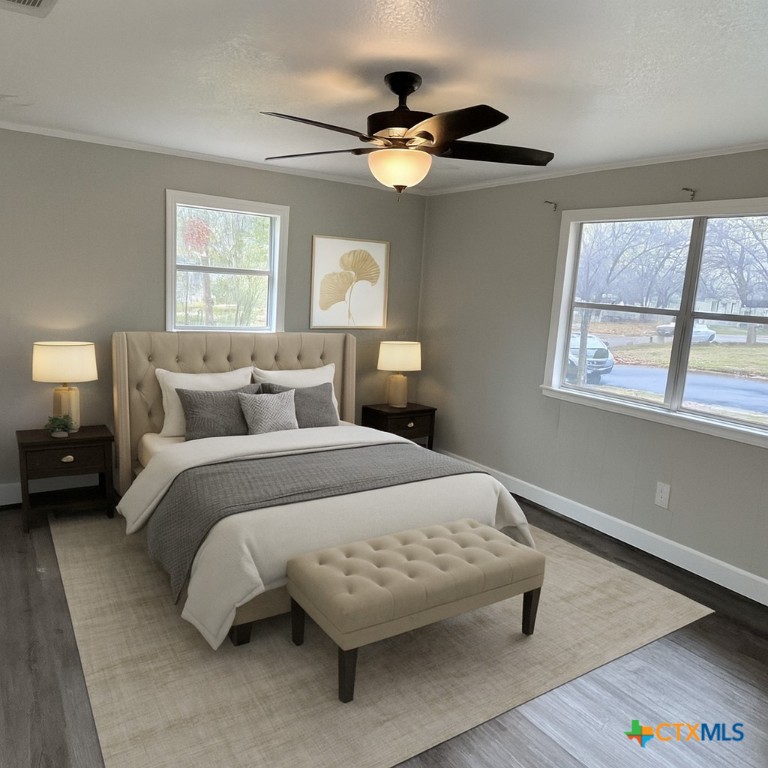 1201 South 21st Street Temple, TX 76504 - Photo 7 of 15 a bedroom with a bed and window