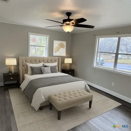 a bedroom with a bed and window