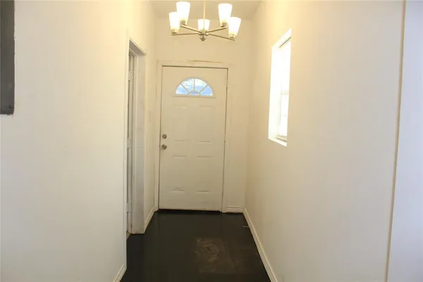 a view of a storage & utility room with a window