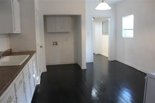 wooden floor in an empty room with a stove