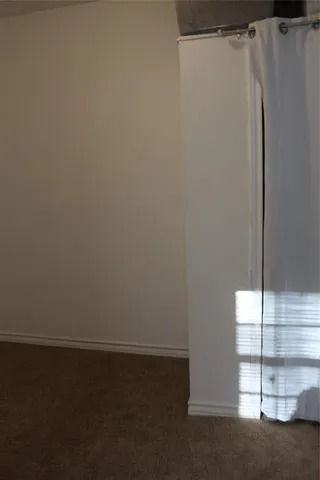 a view of a closet in the kitchen