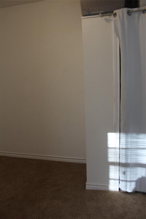 1909 Sycamore Street Commerce, TX 75428 - Photo 17 of 26 a view of a closet in the kitchen