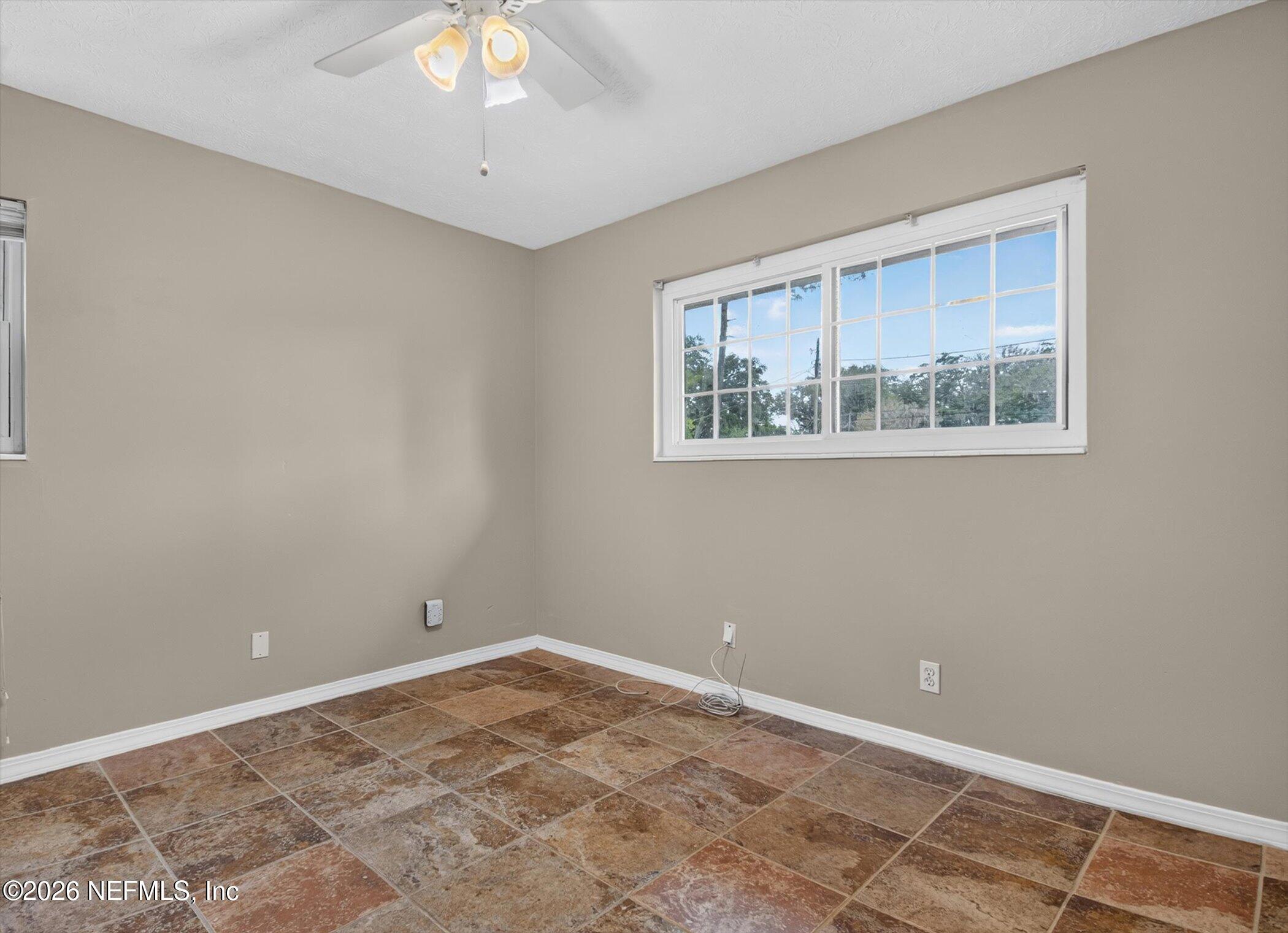 2705 Navajo Road Orange Park, FL 32073 - Photo 31 of 58 a view of an empty room with a window