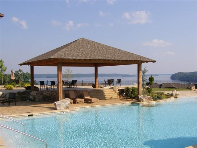 106 Gentle Ridge Way Savannah, TN 38372 - Photo 4 of 9 a view of a house with backyard outdoor seating area and furniture