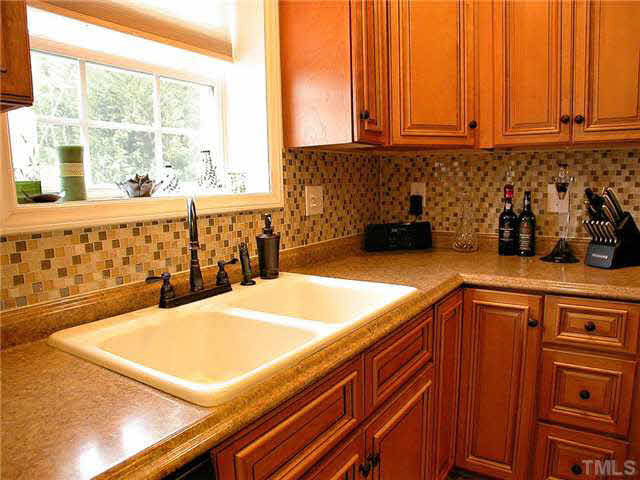 21 Kissimee Court Durham, NC 27713 - Photo 11 of 25 a kitchen with a sink and a window