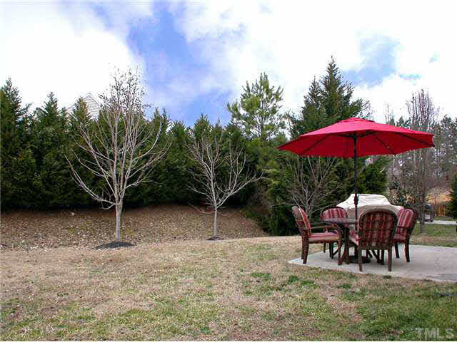 21 Kissimee Court Durham, NC 27713 - Photo 4 of 25 a patio with a patio table and chairs