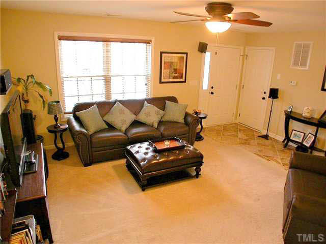 21 Kissimee Court Durham, NC 27713 - Photo 6 of 25 a living room with furniture window and a flat screen tv