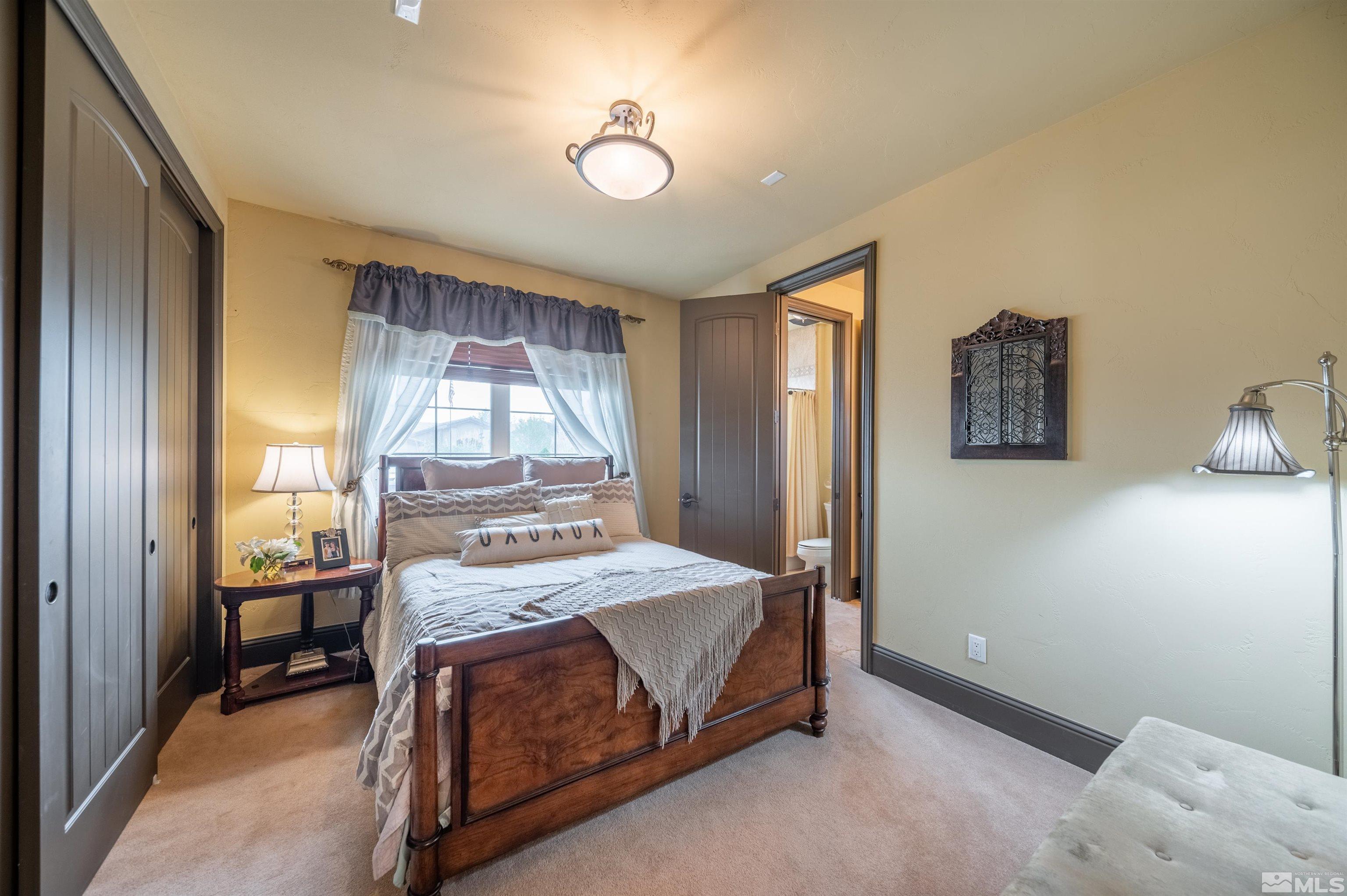4271 Dant Boulevard Reno, NV 89509 - Photo 11 of 24 a bedroom with a bed and a window