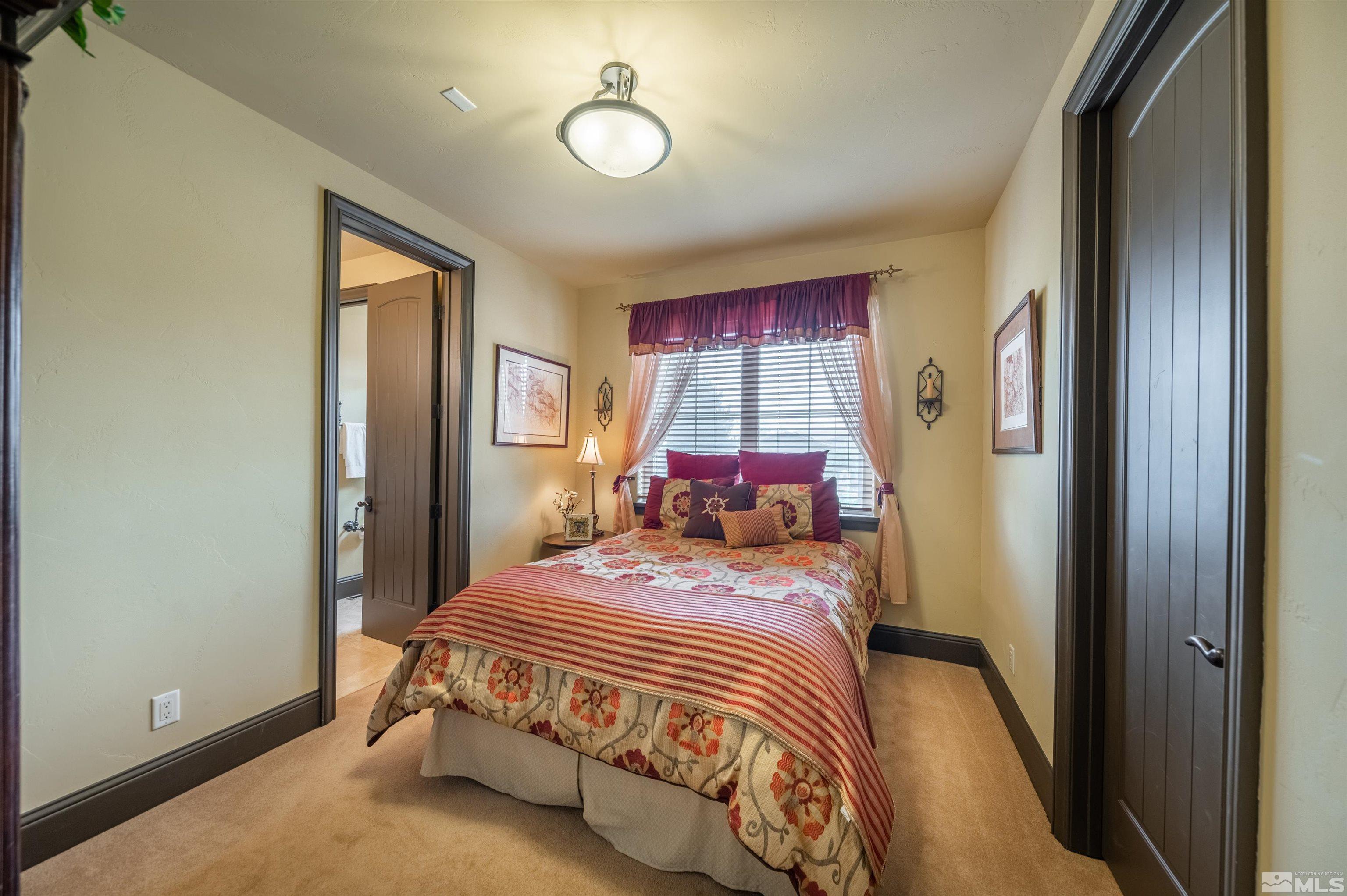 4271 Dant Boulevard Reno, NV 89509 - Photo 13 of 24 a bedroom with a bed and a window