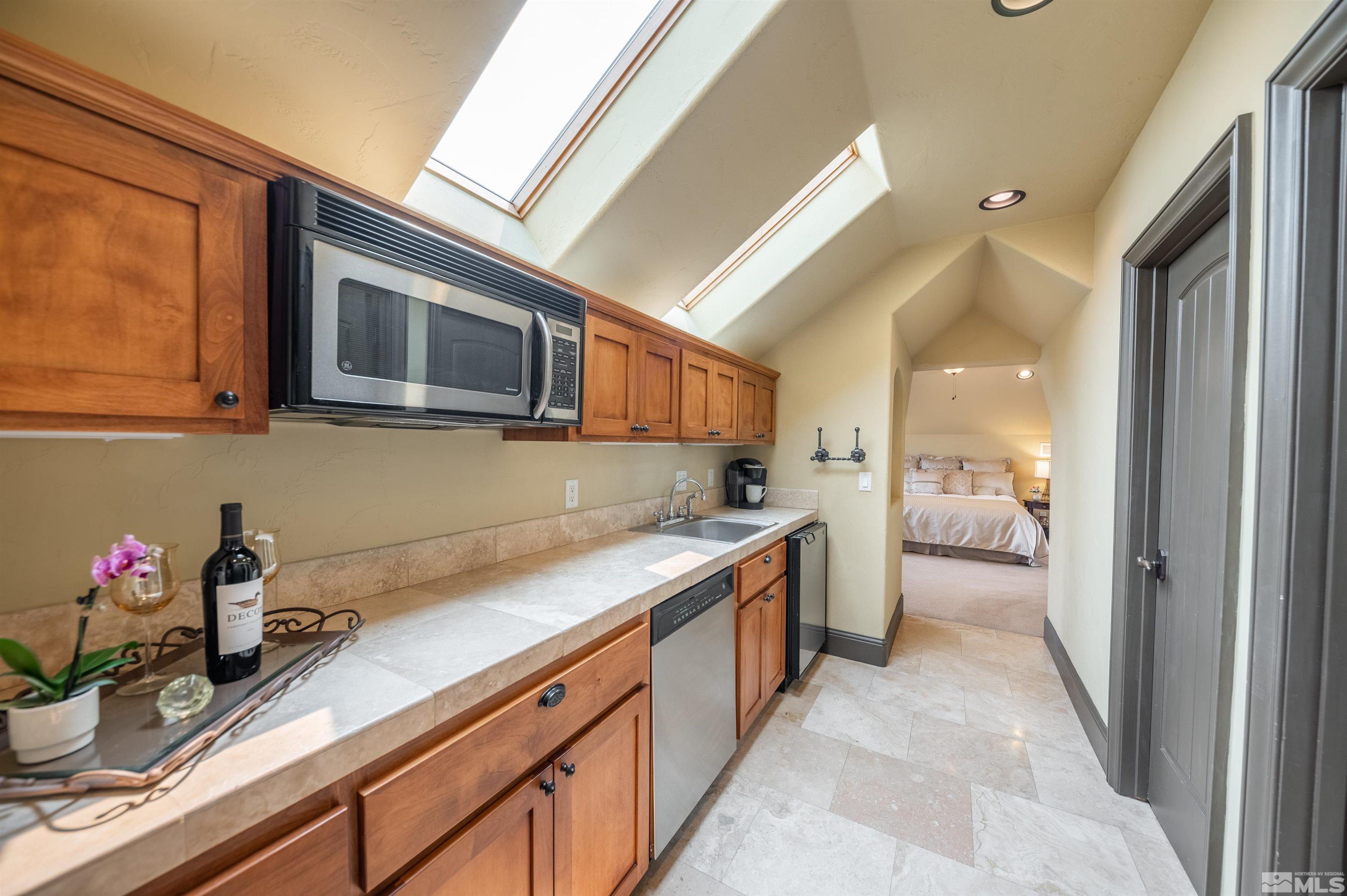 4271 Dant Boulevard Reno, NV 89509 - Photo 17 of 24 a kitchen with a sink and refrigerator