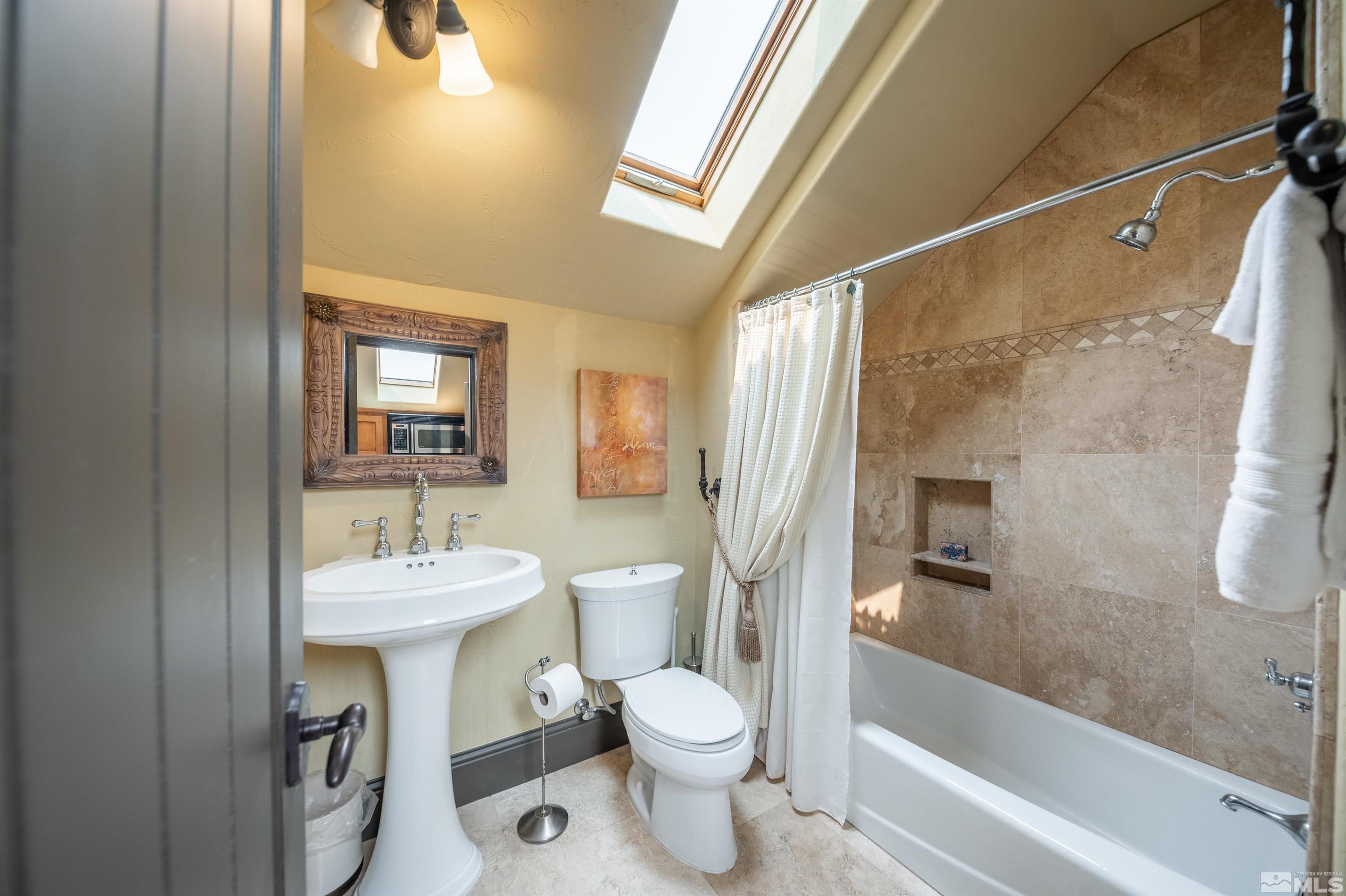 4271 Dant Boulevard Reno, NV 89509 - Photo 18 of 24 a bathroom with a sink toilet and shower