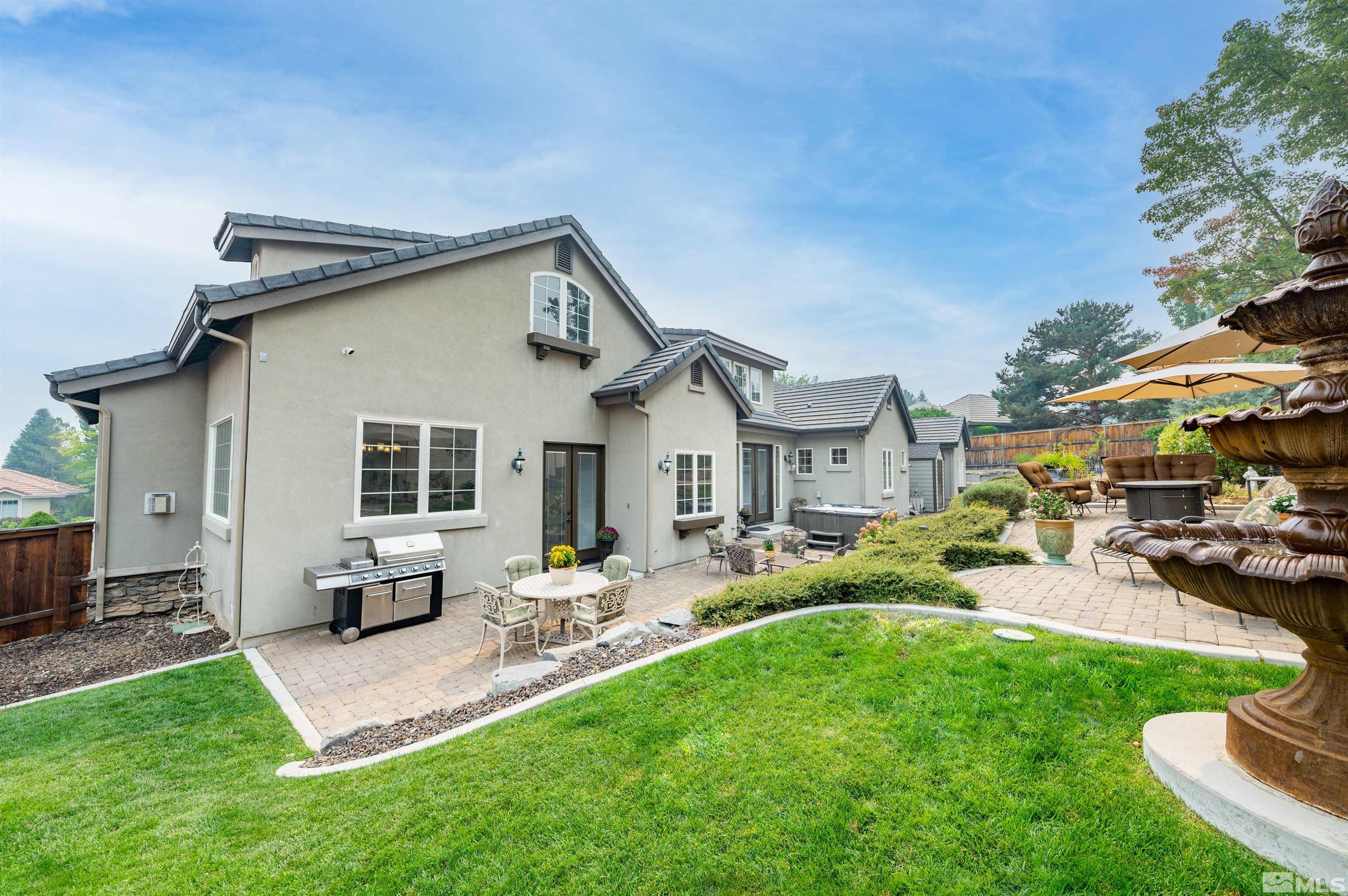 4271 Dant Boulevard Reno, NV 89509 - Photo 22 of 24 a front view of house with yard and outdoor seating