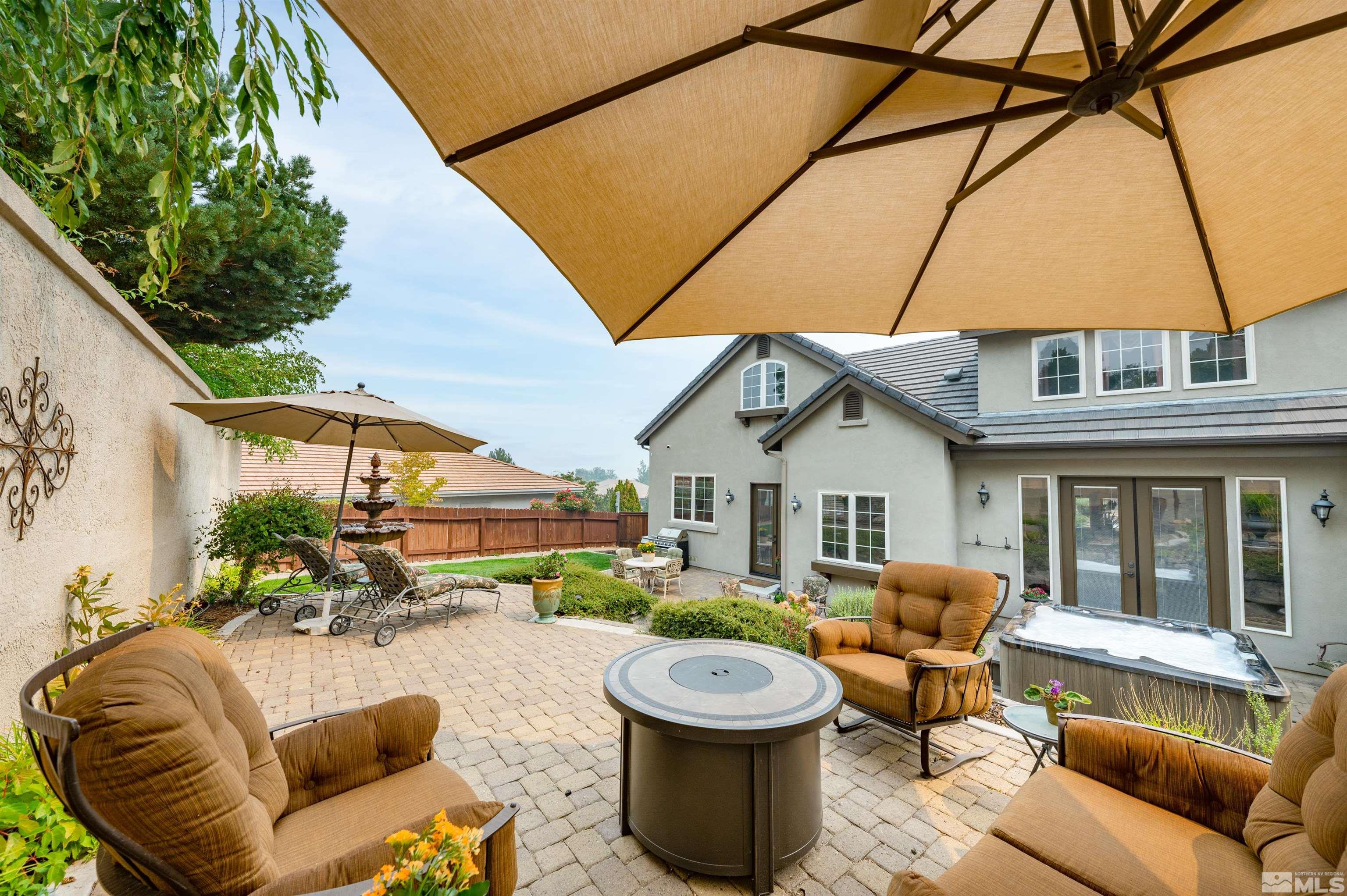 4271 Dant Boulevard Reno, NV 89509 - Photo 24 of 24 a view of a patio with couches table and chairs and potted plants