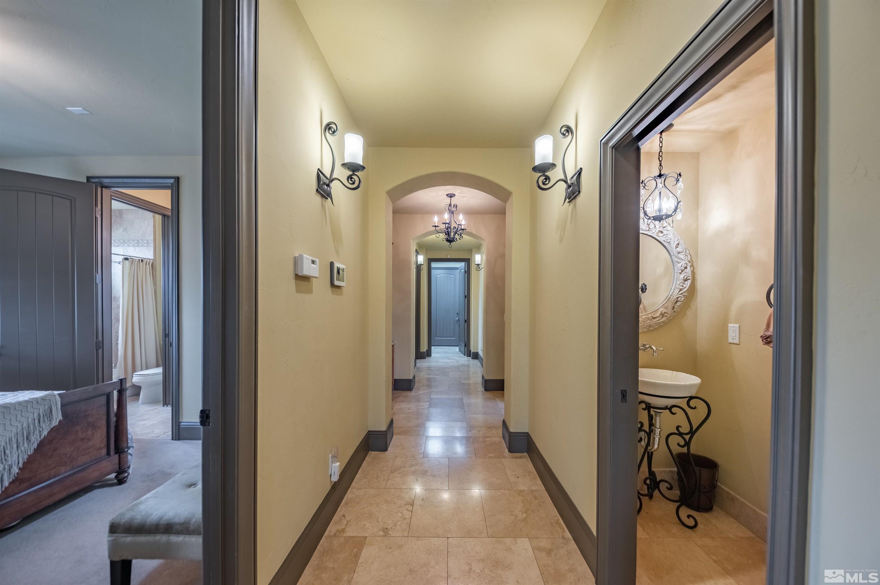 4271 Dant Boulevard Reno, NV 89509 - Photo 7 of 24 a view of a hallway with wooden floor and livingroom with furniture