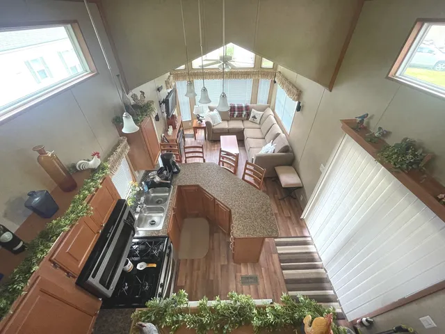 a view of a dining room with furniture wooden floor and a chandelier