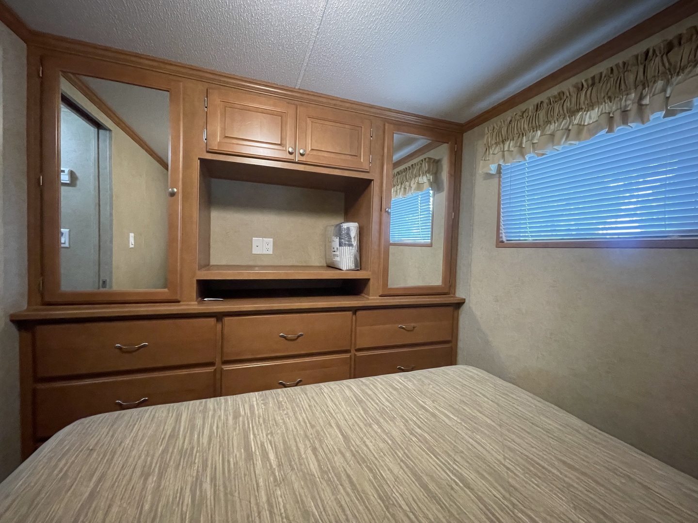 5-50 Woodhaven Lakes Sublette, IL 61367 - Photo 14 of 21 a bedroom with a bed and a television