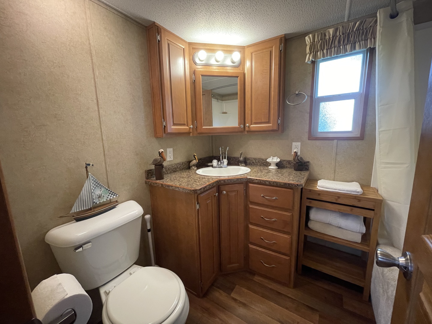 5-50 Woodhaven Lakes Sublette, IL 61367 - Photo 16 of 21 a bathroom with a toilet sink and mirror
