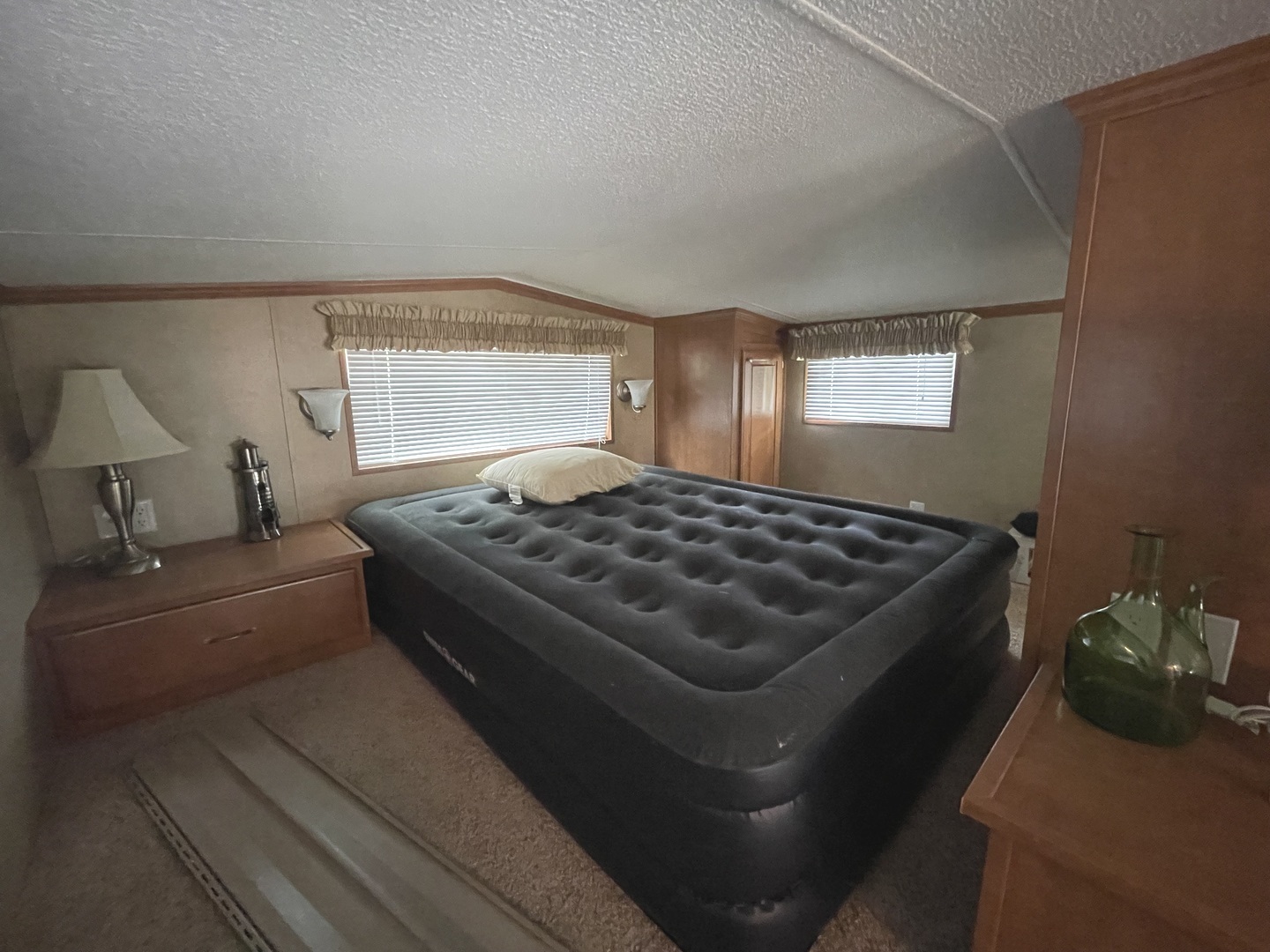 5-50 Woodhaven Lakes Sublette, IL 61367 - Photo 18 of 21 a bedroom with a bed and window