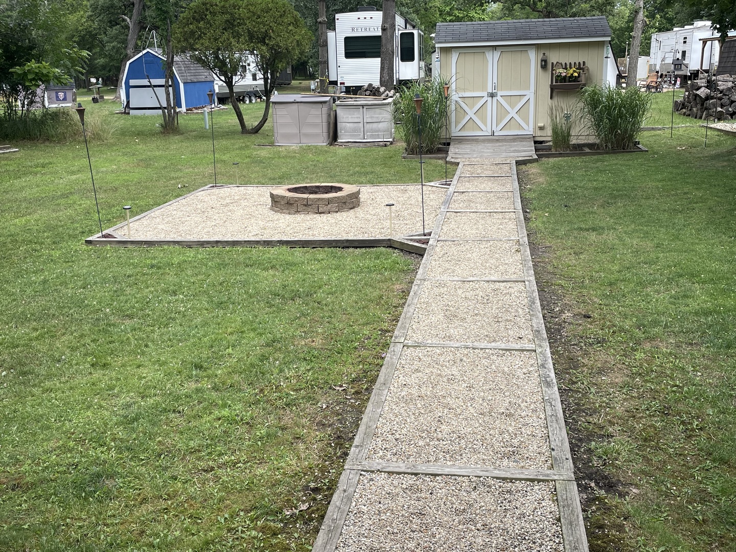 5-50 Woodhaven Lakes Sublette, IL 61367 - Photo 19 of 21 a front view of a house with a yard and trees