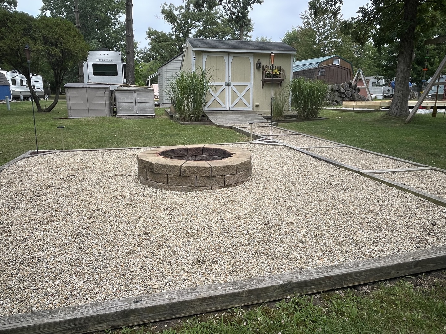 5-50 Woodhaven Lakes Sublette, IL 61367 - Photo 20 of 21 a view of a backyard with a garden and plants