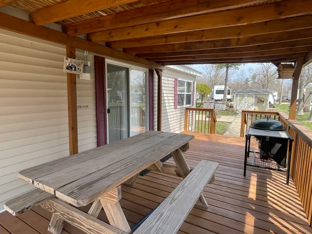 a view of a patio with wooden floor