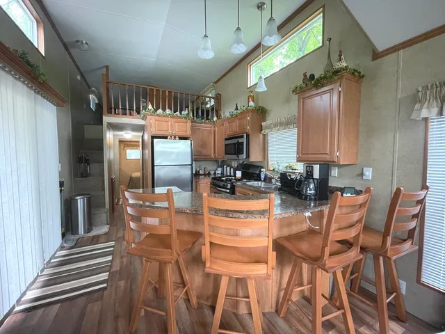a dining room with furniture and a chandelier