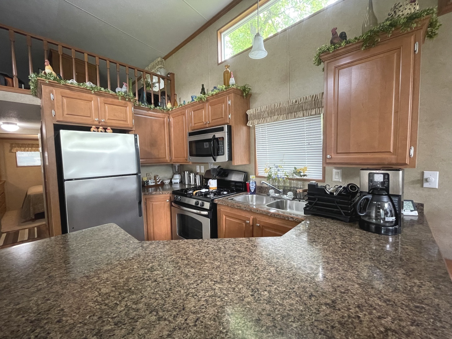5-50 Woodhaven Lakes Sublette, IL 61367 - Photo 7 of 21 a kitchen with granite countertop a refrigerator and a stove top oven