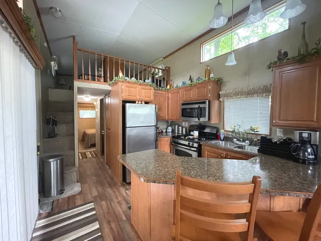 a kitchen with counter top space cabinets and stainless steel appliances