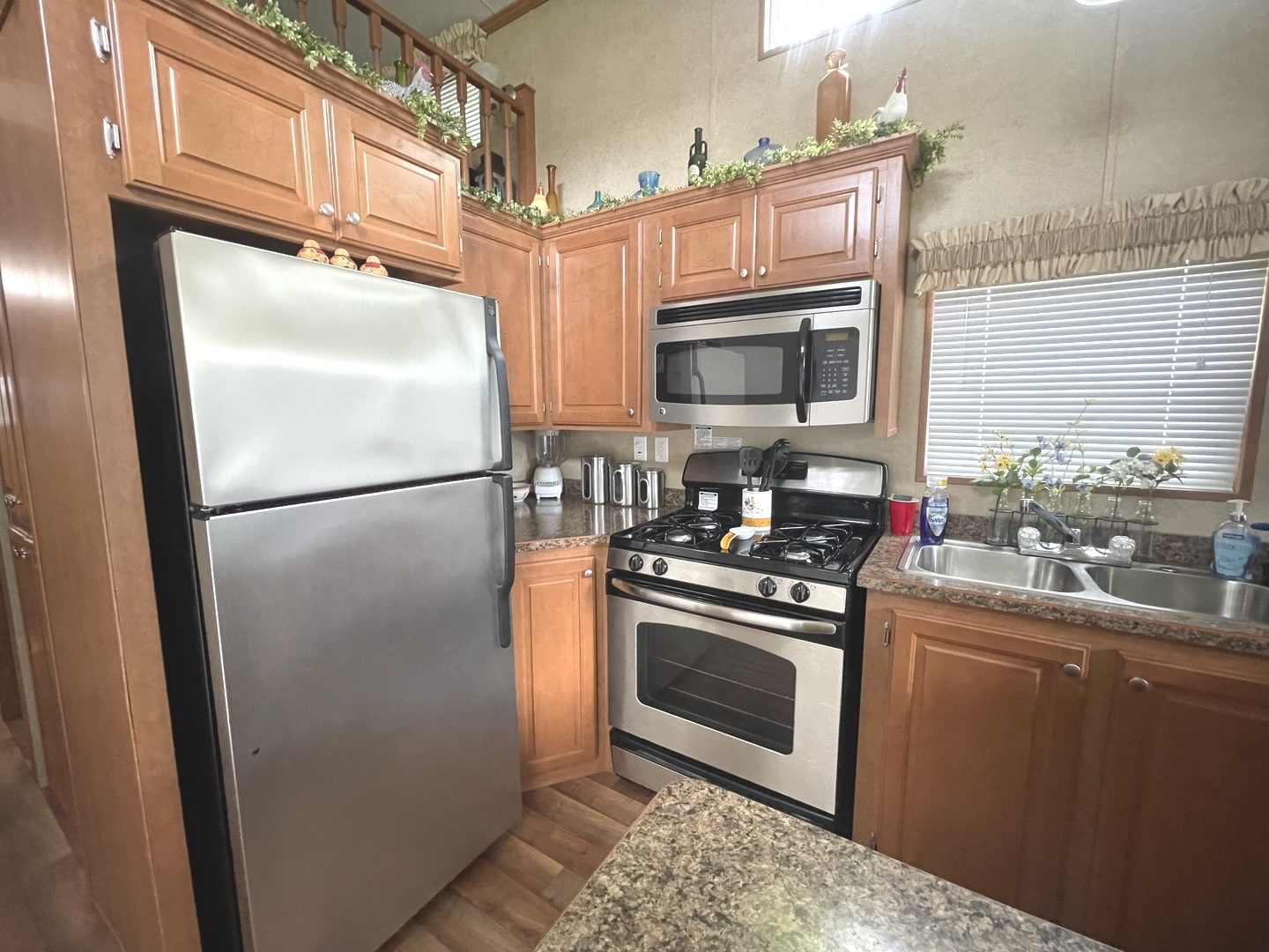 5-50 Woodhaven Lakes Sublette, IL 61367 - Photo 9 of 21 a kitchen with stainless steel appliances granite countertop a refrigerator a stove a sink and dishwasher