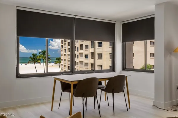 a dining room with a table and chairs