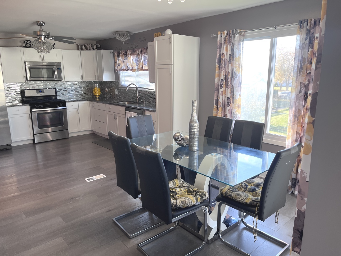 56 Timberlane Road Matteson, IL 60443 - Photo 12 of 40 a living room with stainless steel appliances furniture a window and kitchen view