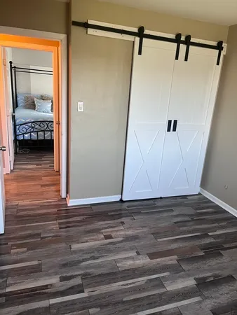 a bathroom with a sink mirror vanity and toilet