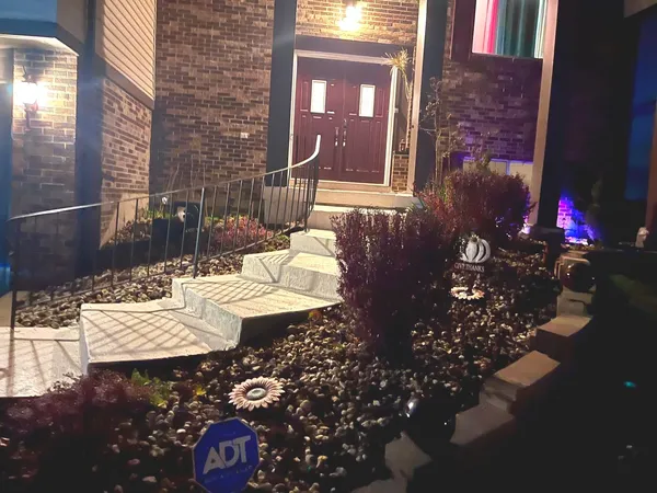 a front view of a house with a yard