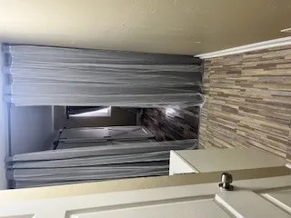 a bathroom with a granite countertop sink a toilet and shower