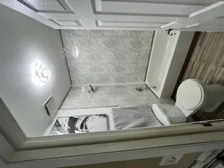 a bathroom with a double vanity sink and mirror