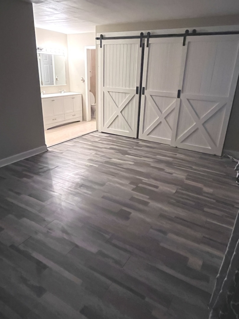 56 Timberlane Road Matteson, IL 60443 - Photo 25 of 40 a view of an empty room with wooden floor and a window