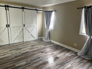 56 Timberlane Road Matteson, IL 60443 - Photo 26 of 40 a view of a room with wooden floor and window