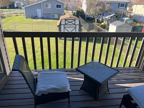 a view of a balcony with furniture