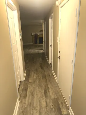 a bathroom with a sink mirror vanity and toilet
