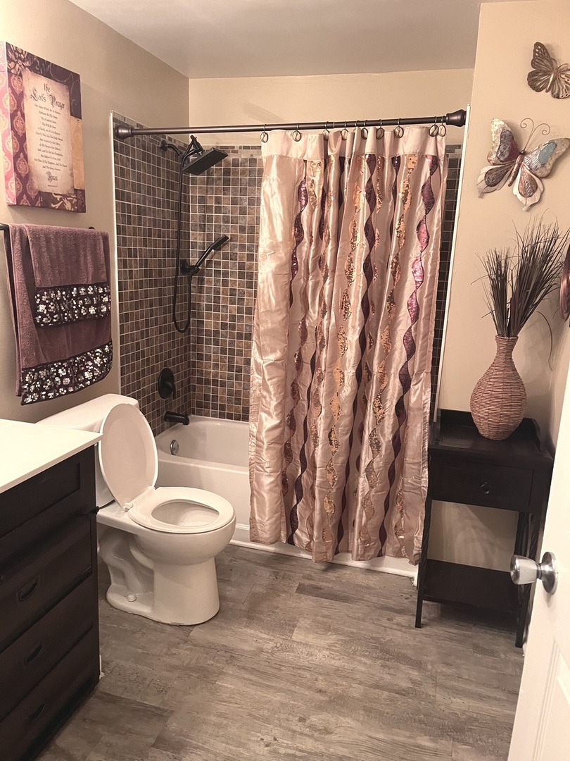 56 Timberlane Road Matteson, IL 60443 - Photo 36 of 40 a white toilet sitting next to a shower curtain