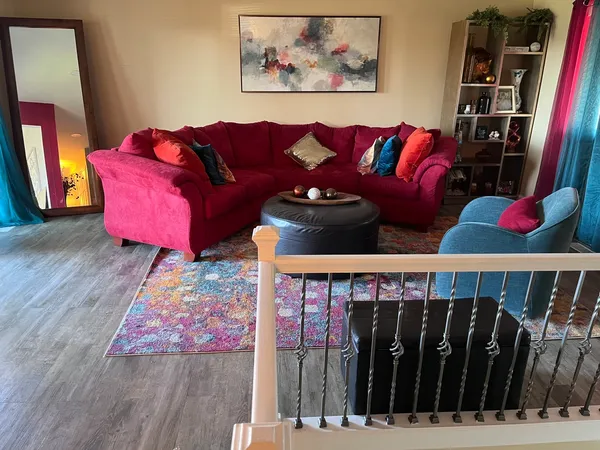 a living room with furniture and a fireplace