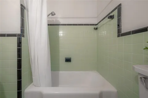 a bathroom with a shower and a toilet