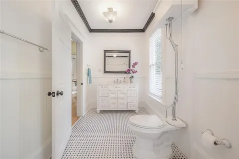 a bathroom with a toilet and a shower