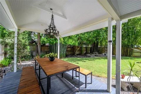 a view of a backyard with sitting area