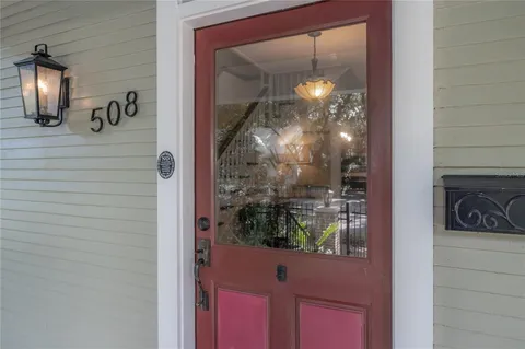 a bathroom with a glass shower door and a mirror