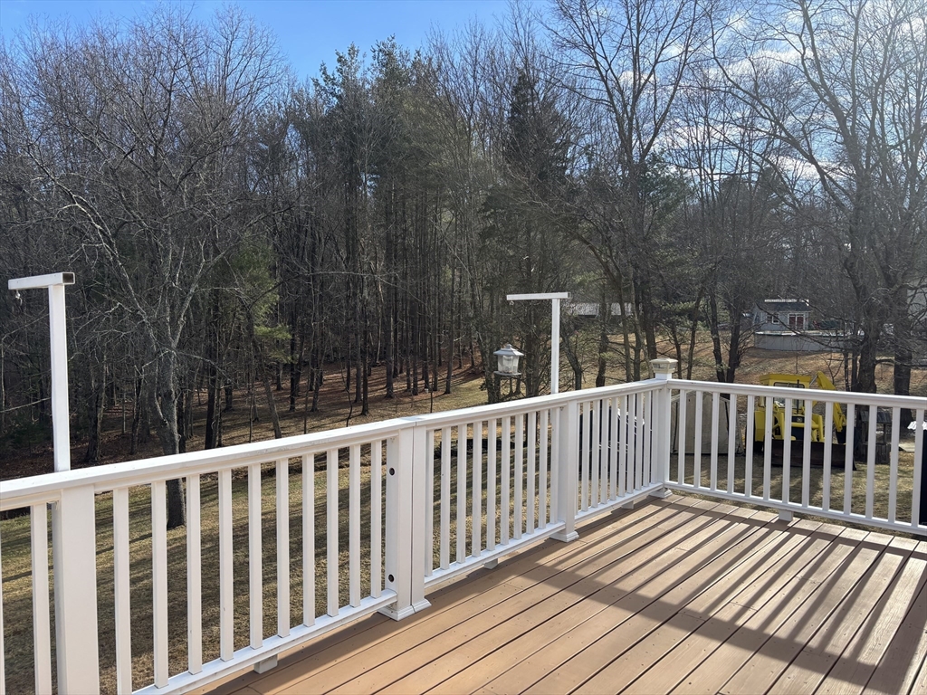 94 Monroe Street, Unit 2 Douglas, MA 01516 - Photo 3 of 10 a view of a wooden roof deck