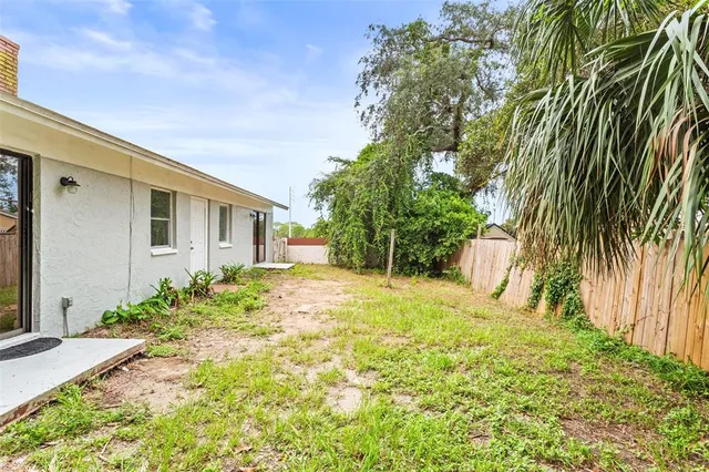 a view of a backyard of the house