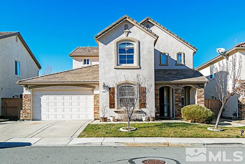 10647 Fort Morgan Way Reno, NV 89521 - Photo 1 of 1 a front view of a house with garden