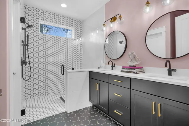 a bathroom with a sink mirror and toilet