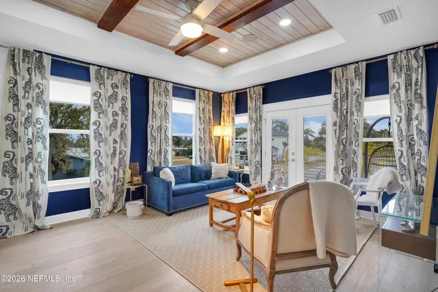 a bedroom with a large bed and a couch